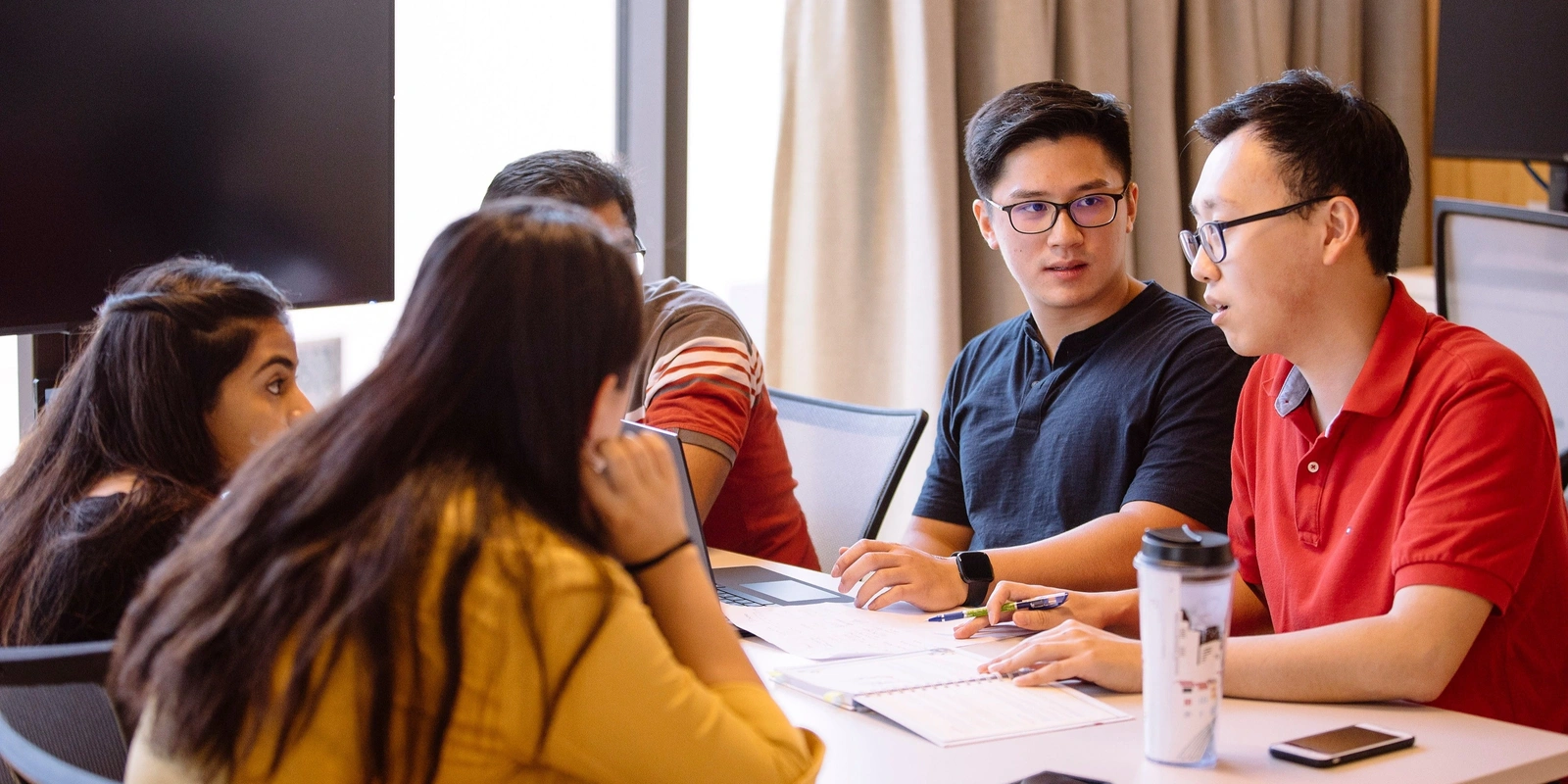 ANU students studying and discussing.
