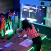 Rosa Rosmery Soto Ruidias, Natasha Pegler, and Ho Yan Or solve a computer science puzzle in a computer science "Escape Room" designed by Dr Bernardo Pereira Nunes.