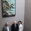 Michael and Laurie McRobbie AO are joined by ANU Vice-Chancellor Professor Brian Schmidt AC pose with the painting donated to ANU in Professor McRobbie’s honour.